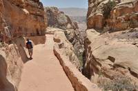 Margaret returning down the path from the monastery