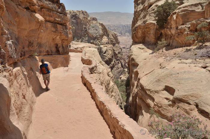 Margaret returning down the path from the monastery