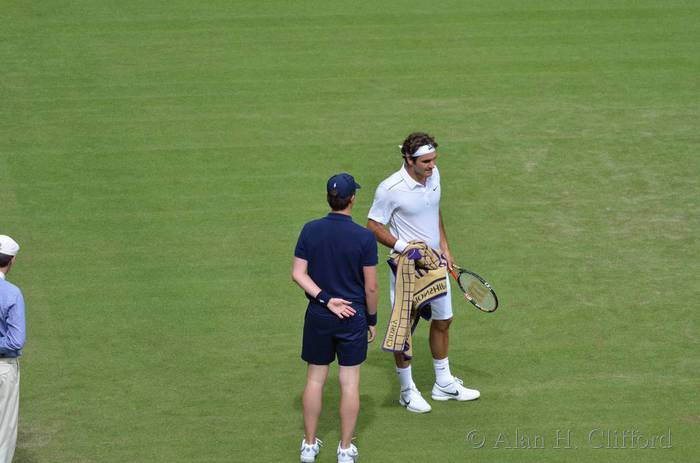 Roger Federe with ball boy