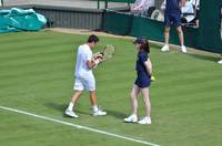 Mikhail Kukushkin with ball girl