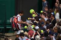 Roger Federe signs souvenirs