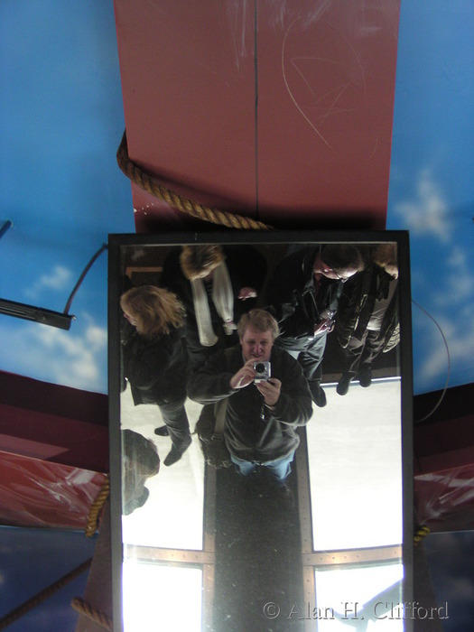 Alan in the mirror above the glass floor, CN tower, Toronto